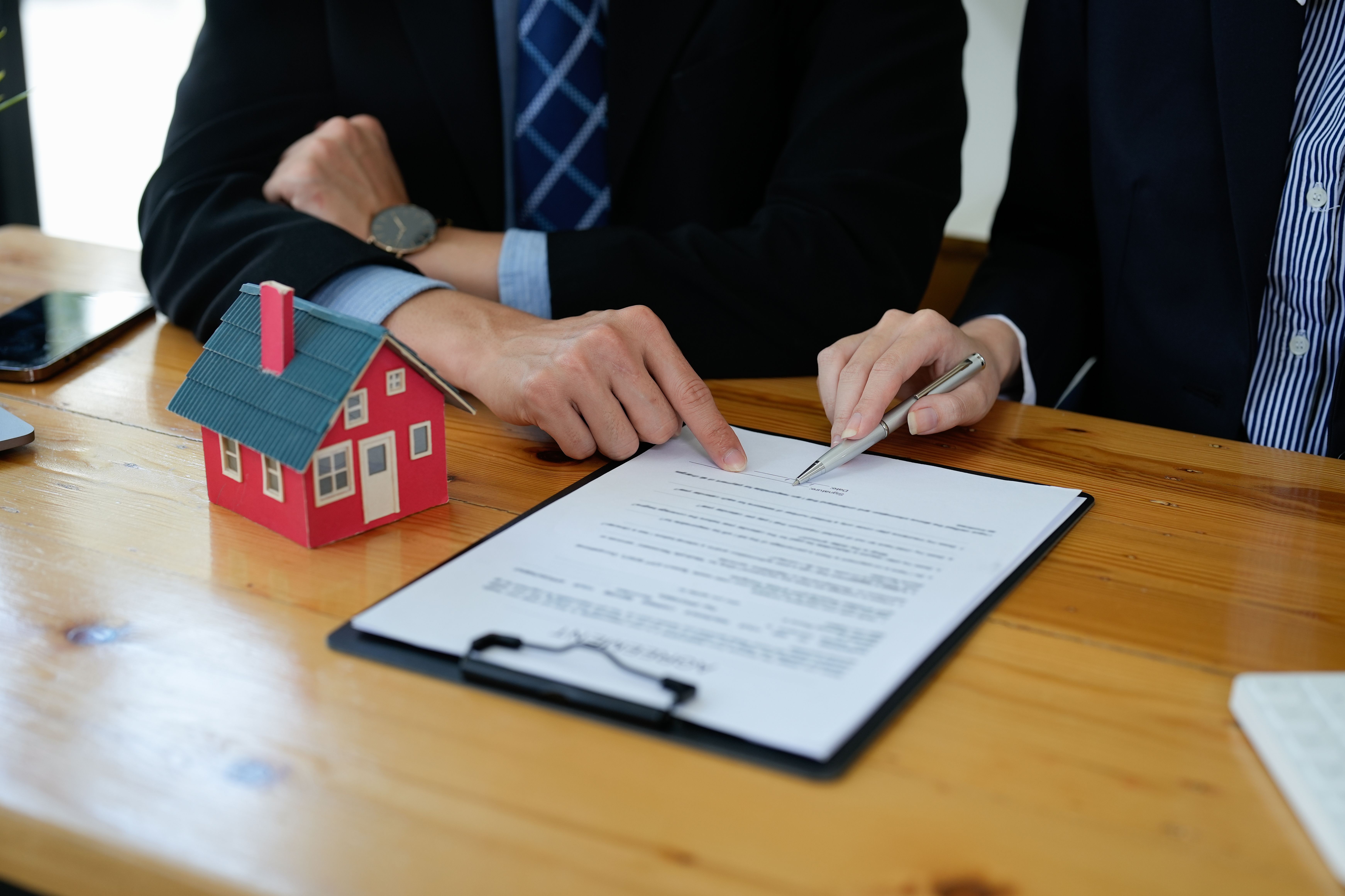 real-estate-agent-talked-about-terms-home-purchase-agreement-asked-customer-sign-documents-make-contract-legally-home-sales-home-insurance-concept.jpg